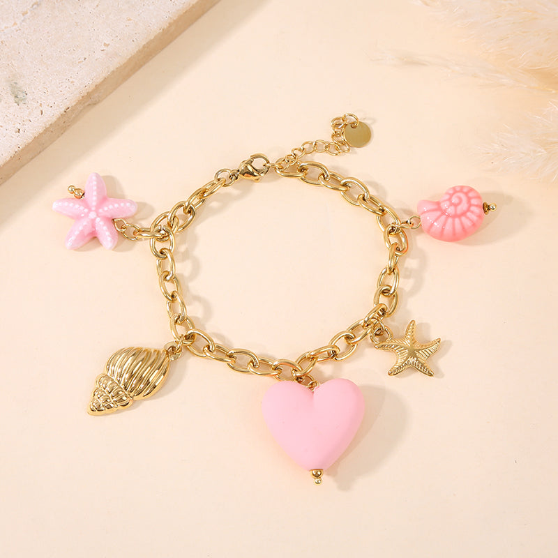 Bracelet doré breloques mer colorée rose