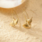 Boucles d'oreilles arc longues dorées feuille de ginkgo