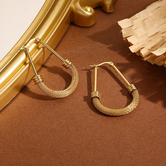 Boucles d'oreilles créoles allongés dorées texturés