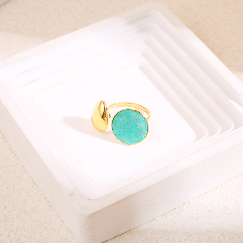 Bague dorée ouverture devant goutte avec pierre ronde