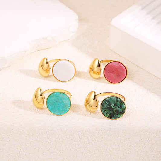 Bague dorée ouverture devant goutte avec pierre ronde