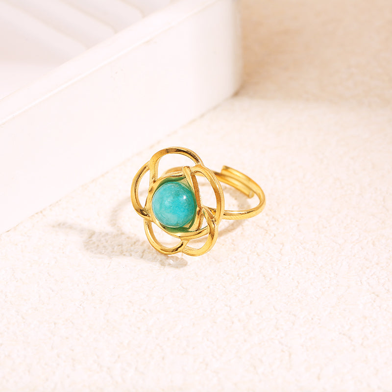 Bague dorée fleur avec pierre interne ronde