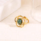 Bague dorée fleur avec pierre interne ronde