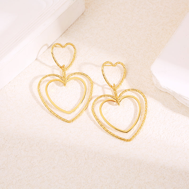 Boucles d'oreilles pendantes double cœur fins