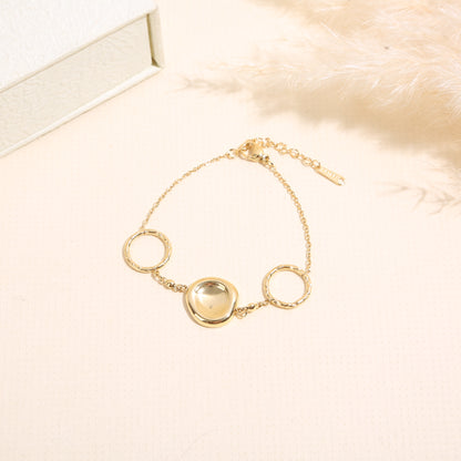 Bracelet anneaux martelés médaillon lisse