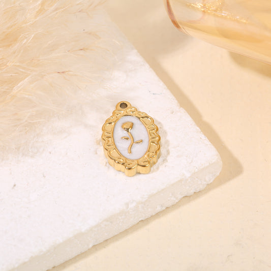 Lot de 3 pendentifs dorés cadre ovale émail fleur centrale