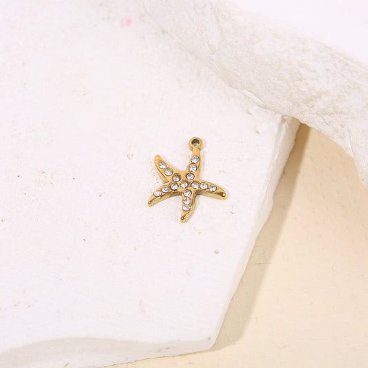 Lot de 3 pendentifs dorés étoiles de mer strassées